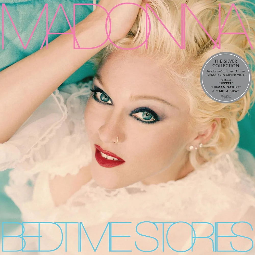 Album cover featuring a person with blonde hair and red lipstick, with text and a vinyl record design.