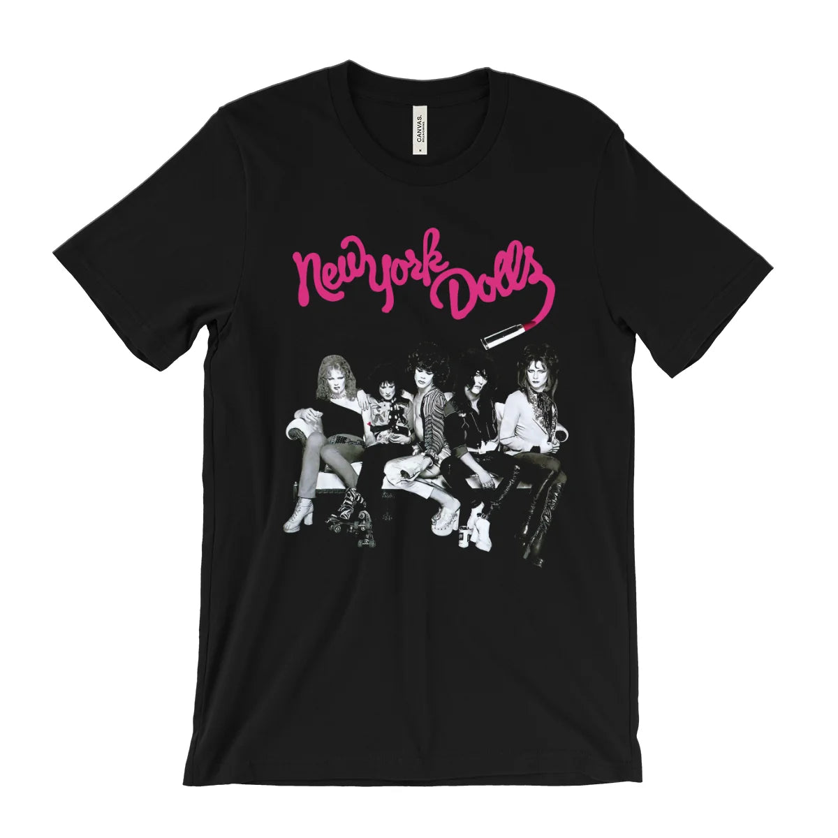 A black short-sleeve graphic t-shirt featuring the pink 'New York Dolls' band logo and a black-and-white photo print of the band members on the front, displayed against a solid white background.