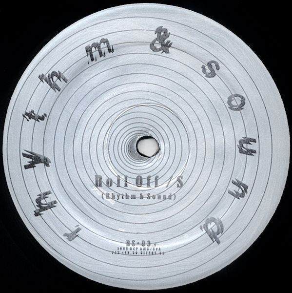 Close-up of a vinyl record label with text and concentric circles.