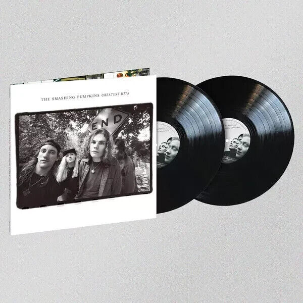 A vinyl record and its cover with The Smashing Pumpkins band members on it.