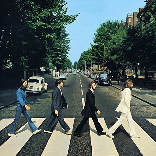 The Beatles album cover, featuring the band members crossing a road at the Abbey Road studios entrance.