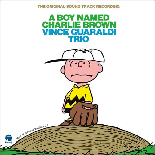 Cover art for the vinyl LP reissue of 'A Boy Named Charlie Brown' by the Vince Guaraldi Trio, featuring an illustration of the character Charlie Brown sitting on a grassy hill.