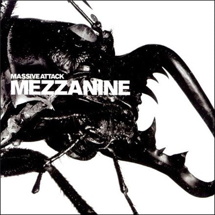 Album cover for Massive Attack's Mezzanine featuring a black and white image of a insect-like figure with wires and mechanical parts.
