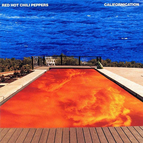 Album cover of Red Hot Chili Peppers - Californication featuring a photograph of a pool with a red-to-orange gradient, bordered by a wooden deck and beyond it a scenic view of the ocean and sky.