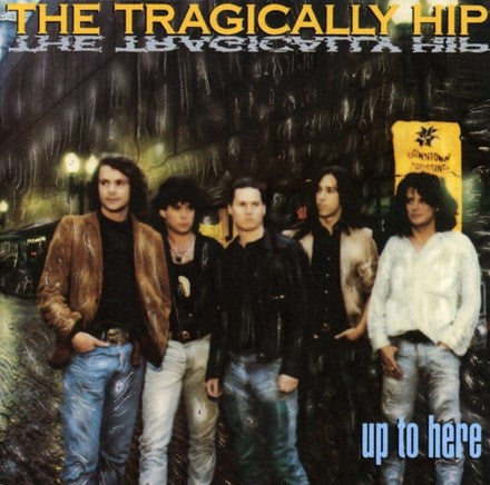 Album cover of The Tragically Hip - Up To Here featuring a photograph of the band members in casual attire, with the band name and album title printed at the top and bottom.