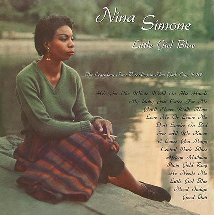 The cover of the Nina Simone album 'Little Girl Blue' features a black and white photo of Nina Simone seated by a body of water, with tracklisting and additional album details.