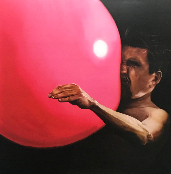 A vinyl record album cover featuring a person holding a large red balloon, with a dark background.
