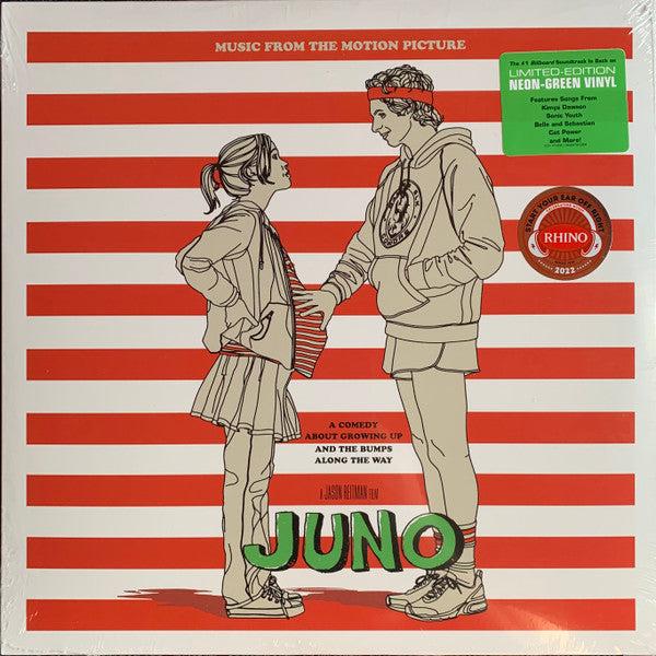 Record cover for 'Juno (Music From The Motion Picture) LP' featuring an illustration of two teenagers, a boy and a girl, standing close to each other with a backdrop of red and white stripes. The name 'Juno' is prominently displayed in the center in a large, green font.