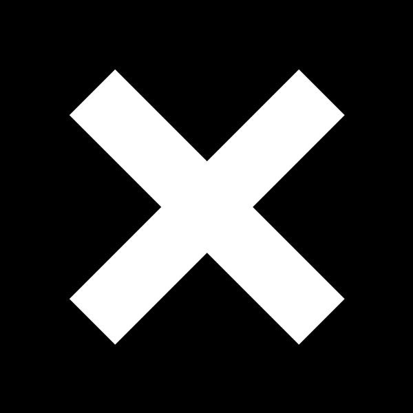 Record cover with a large white cross on a black background, representing the band The XX.