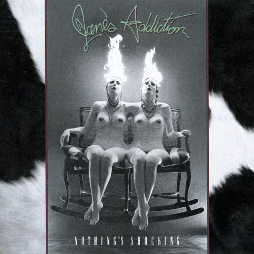This image features the album cover of "Jane's Addiction – Nothing's Shocking LP." It displays a provocative and artistic photograph of two individuals seated on a rocking chair, each with flames emerging from their heads, suggesting a bold and revolutionary theme.