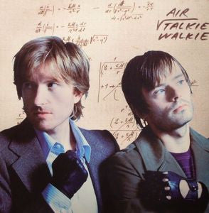 Album cover featuring two members of Air band, with mathematical equations in the background.