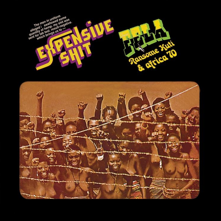 Album cover for Fela Kuti's 'Expensive Shit' featuring a black and white photograph of a group of people behind barbed wire with a pink and yellow titled text overlay.