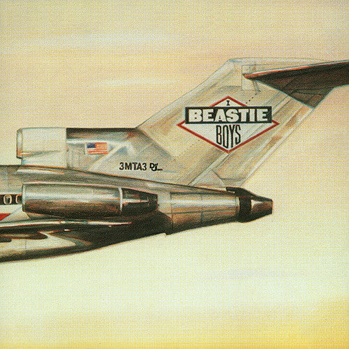 Album cover of Beastie Boys - Licensed To Ill LP with an illustration of a airplane crashing into a mountain, featuring the text 'BEASTIE BOYS' on the tail.