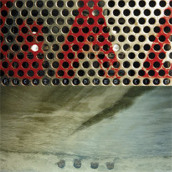 Album cover art for Fugazi's Red Medicine LP featuring a close-up of a metallic grid with a reflection.