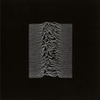 Album cover art for Joy Division's 'Unknown Pleasures' featuring a black background with a white line graphic design.