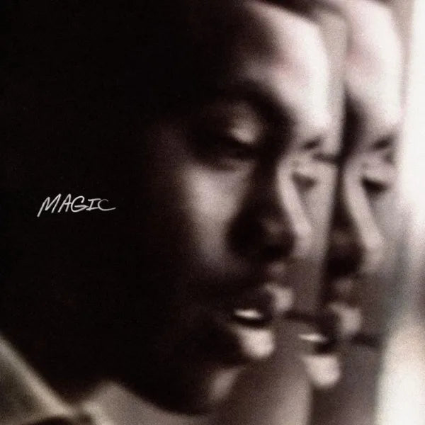 Black and white album cover featuring a close-up of a person's face with the text 'MAGIC'.