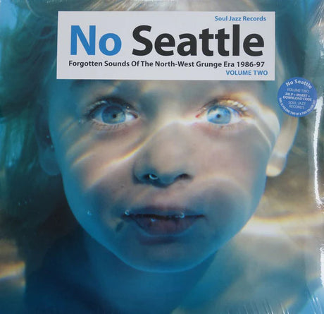 Album cover for 'No Seattle' by Soul Jazz Records with a child's face and text.