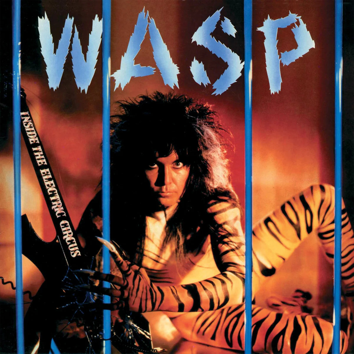 Album cover with a person in a tiger costume and 'WASP' text