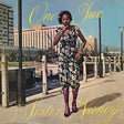 Album cover with a woman standing on a dock, featuring the text 'One Two Sister Nancy'.