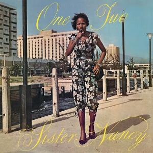 Album cover with a woman standing on a dock, featuring the text 'One Two Sister Nancy'.