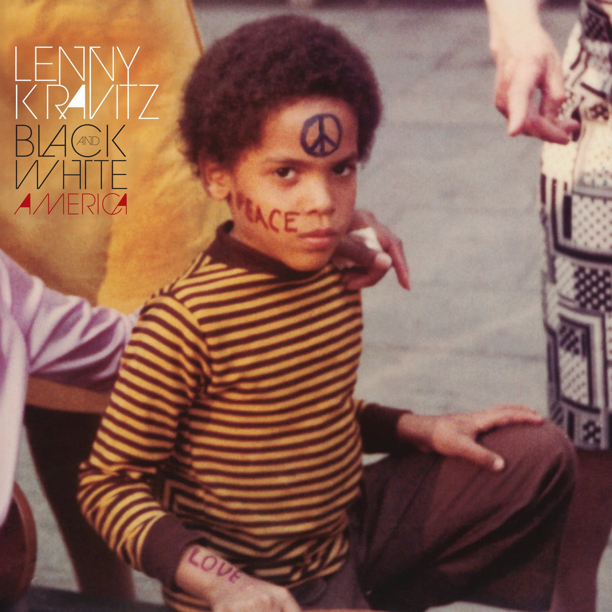 Album cover with a child wearing a striped shirt and pants, with text and symbols on their face.