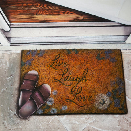 Doormat with 'Live Laugh Love' text and sandals on a stone floor.