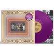 Vinyl record with a purple disc and cover featuring a group of people, on a white background.