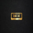 Gold cassette tape design on a black background with 'The Bamboos Best' text.