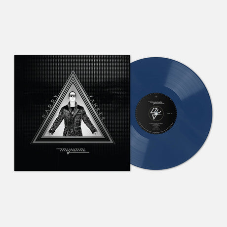 A vinyl record and its sleeve on a light gray background. The sleeve is black with a grayscale triangular portrait of a man wearing sunglasses, and the record itself is a translucent dark blue with a black center label.