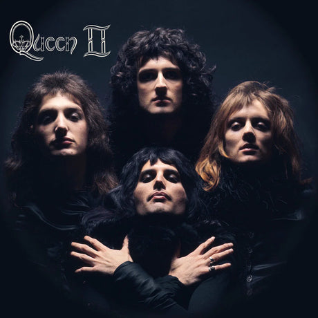 Vintage album cover of Queen with four band members in dark clothing.