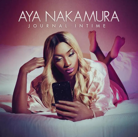 Album cover with a person lying on a bed using a phone, featuring the text 'Aya Nakamura Journal Intime'.