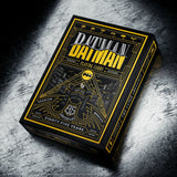 Batman playing cards box on a textured surface