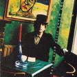 Album cover featuring a person in a room with a painting and candle.