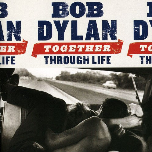 Album cover with 'Bob Dylan' text and a black and white photo of two people in a car.