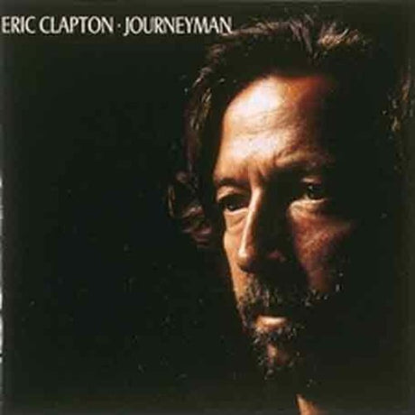 Album cover of 'Journeyman' by Eric Clapton with a close-up of the artist's face.