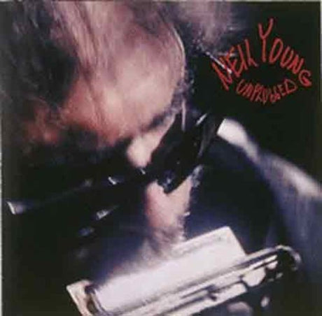 Album cover with a person playing a piano and 'Neil Young Unplugged' text.