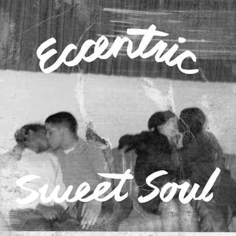 Album cover with text 'Eccentric Sweet Soul' and a group of people in a snowy setting.
