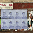 Sheet of paper with multiple images of a person wearing a cap, attached to a wall with peeling paint.