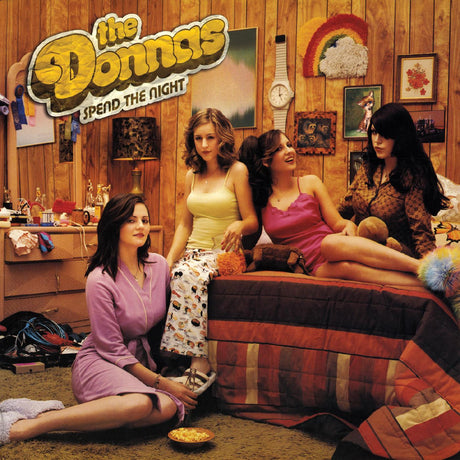 Four women in a room with 'The Donnas' logo and text 'Spend the Night'.
