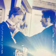Album cover with two people shaking hands against a blurred cityscape background, featuring text 'The Watchowers' and 'Dalek's Good + Roland Reed Party'.