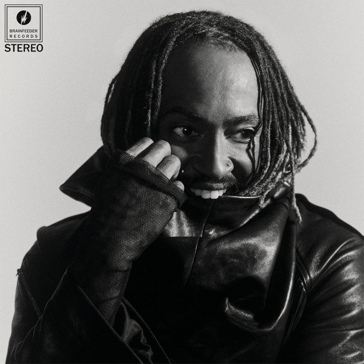 Black and white album cover with a person wearing a leather jacket and holding a phone to their ear, featuring Bravado Music Records logo.