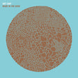 Album cover with intricate brown pattern on a light blue background, featuring the text 'Hot Chip Made in the Dark'.