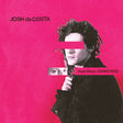 Album cover with a person holding a book titled 'New Wave Graveyard' by Josh da Costa on a pink background.