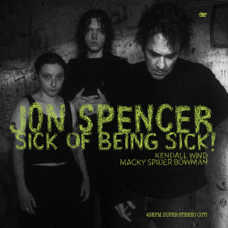 Album cover with text 'Jon Spencer Sick of Being Sick!' featuring three people in a dark setting.