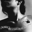 Black and white tattoo of a helicopter and text on a person's shoulder