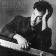 Album cover featuring Billy Joel with text 'Billy Joel Greatest Hits Volume I & Volume II' on a gray background.