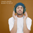 Person wearing headphones with 'Craig David Born To Do It' text on a brown background