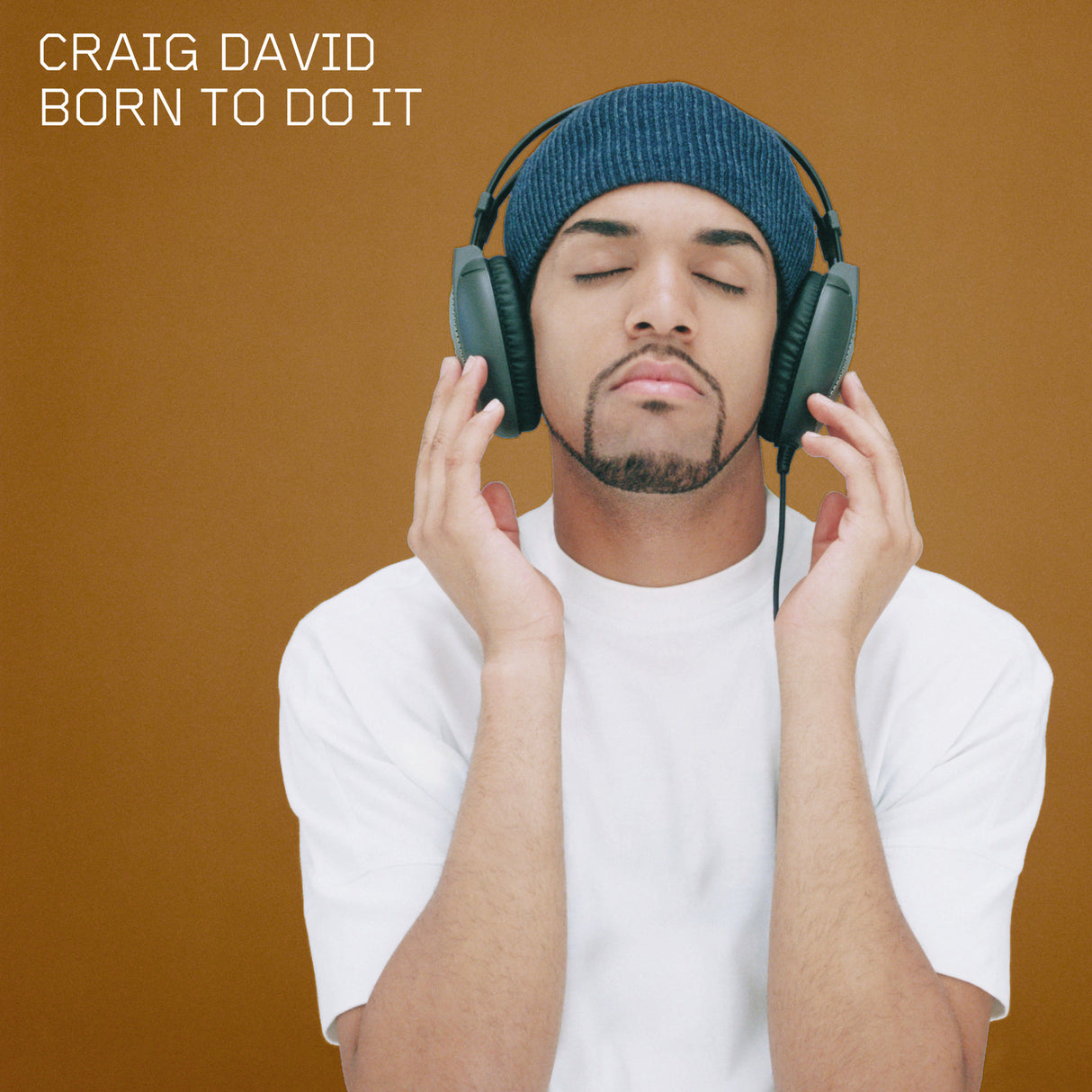 Person wearing headphones with 'Craig David Born To Do It' text on a brown background