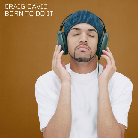 Person wearing headphones with 'Craig David Born To Do It' text on a brown background