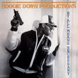 Album cover for Boogie Down Productions' 'By All Means Necessary' with two individuals in jackets and hats.